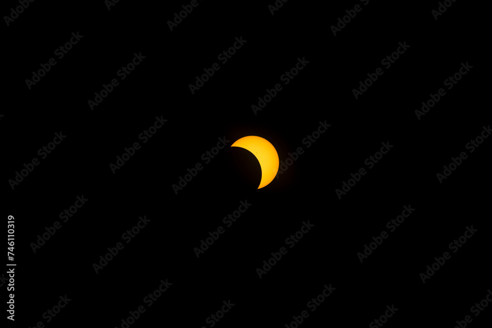 Various phases of an eclipsed sun. The moon in front of the sun, showing a crescent sun. Solar eclipse 2017 Various phases of an eclipsed sun. The moon in front of the sun, showing a crescent sun. Solar eclipse 2017