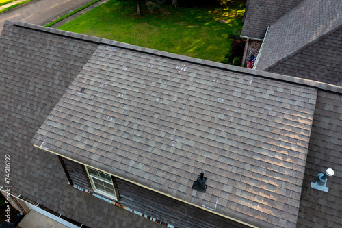 Roof with hail damage and markings from inspection photo