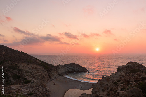Fototapeta Naklejka Na Ścianę i Meble -  Amazing Nas beach with Chalares river bed and impressive canyon at sunset, Ikaria islands, Greece