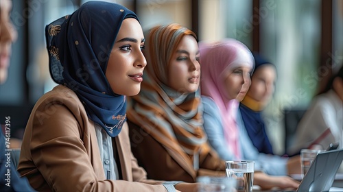 Wallpaper Mural a conference room in Saudi Arabia featuring young employees from the country engaged in communication, highlighting their professional interactions. Torontodigital.ca