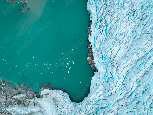 drone shot of an iceberg in Svalbard, a large piece of iceberg on the water in the middle of wild and frozen nature, usable for magazines and magazines, travel to arctic countries, Svalbard