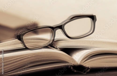 Diplopia concept Diagnosis in Ophthalmology. Glasses and book