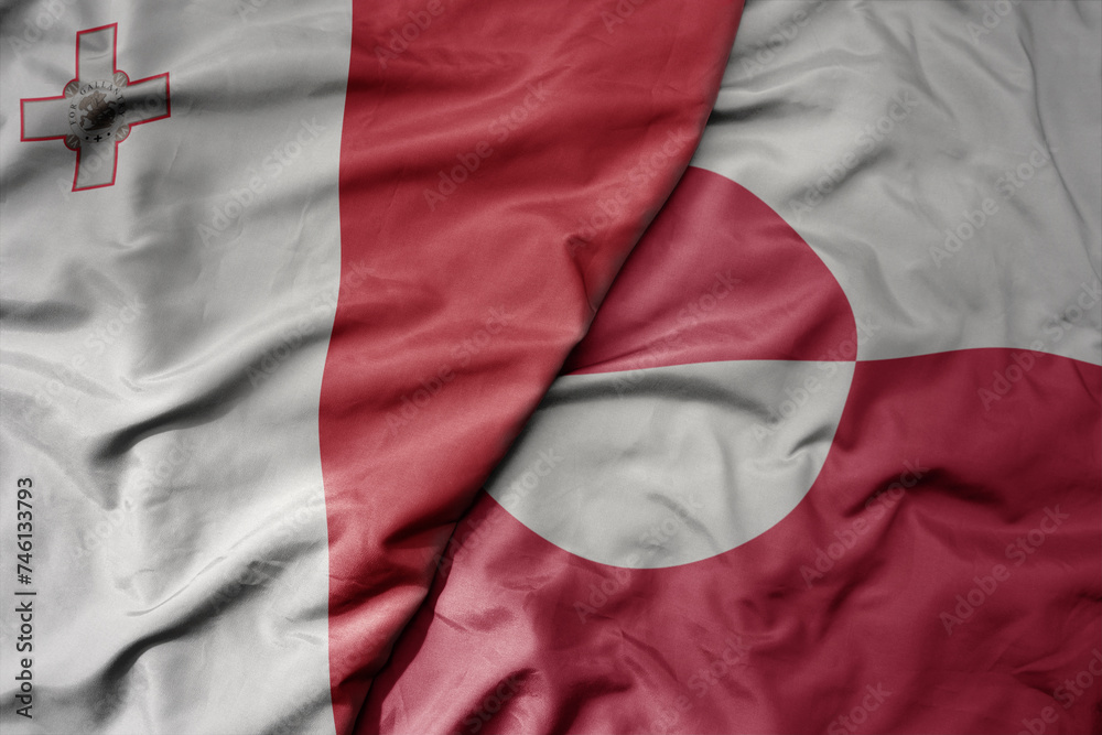 big waving national colorful flag of greenland and national flag of malta.