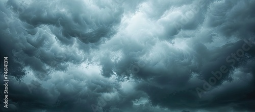 A large, dark storm cloud fills the sky, signaling the approach of heavy rain.