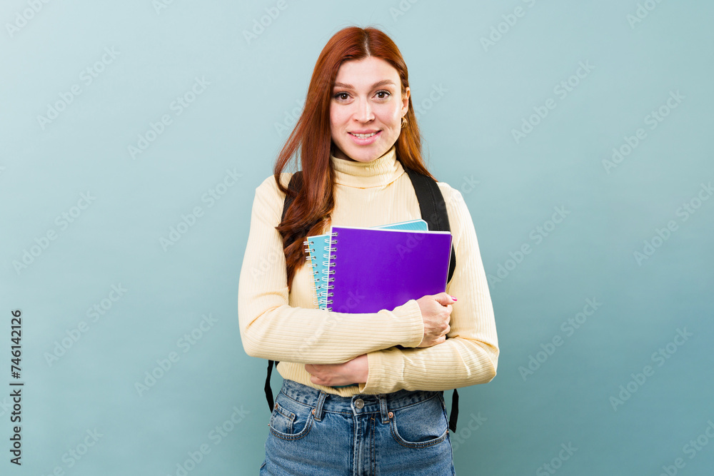 Beautiful redhead woman going to college to study