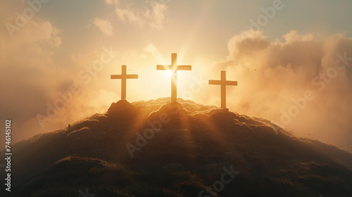 Three crosses up on a hill at sunset, Crucifixion of Jesus Christ concept photo