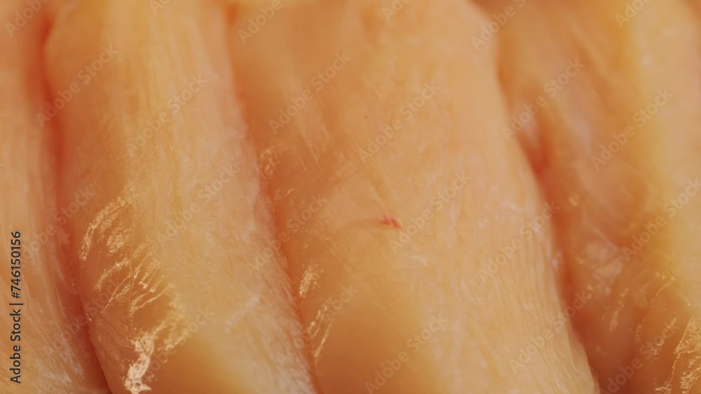 Cutting with knife raw chicken meat on desk close-up. Preparing raw food for cooking. Grilled chicken, duck, turkey kebab with vegetables. Cutting with knife raw chicken meat on desk close-up. Preparing raw food for cooking. Grilled chicken, duck, turkey kebab with vegetables.