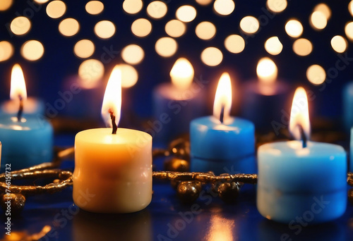 Lit candles at the Hanukkah festival of lights on a blue background