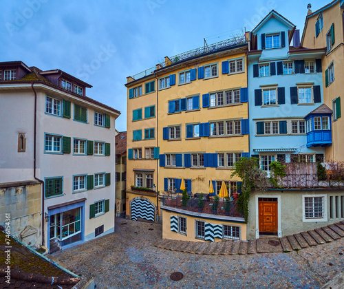 The scenic residential houses on Romergasse street next to Grossmunster, Zurich, Switzerland photo