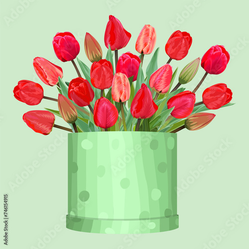 Bouquet of red tulips in a gift box on a green background 