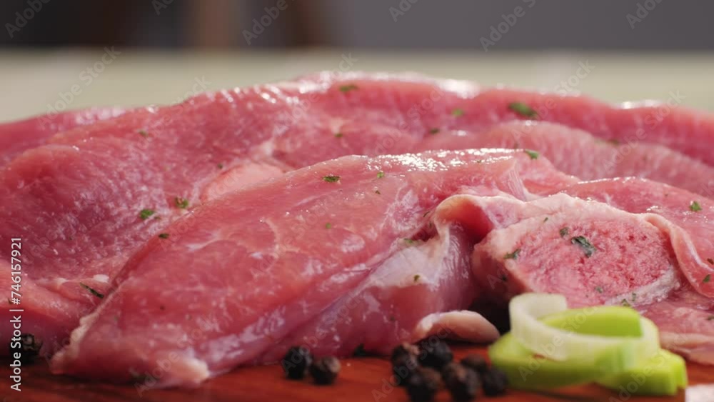 Raw slice beef meat in spices: paprika, salt, pepper, turmeric on plate close-up. Preparing raw food for cooking. Grill and Fry beef, pork, chicken, duck, turkey kebab with vegetables. Raw slice beef meat in spices: paprika, salt, pepper, turmeric on plate close-up. Preparing raw food for cooking. Grill and Fry beef, pork, chicken, duck, turkey kebab with vegetables.