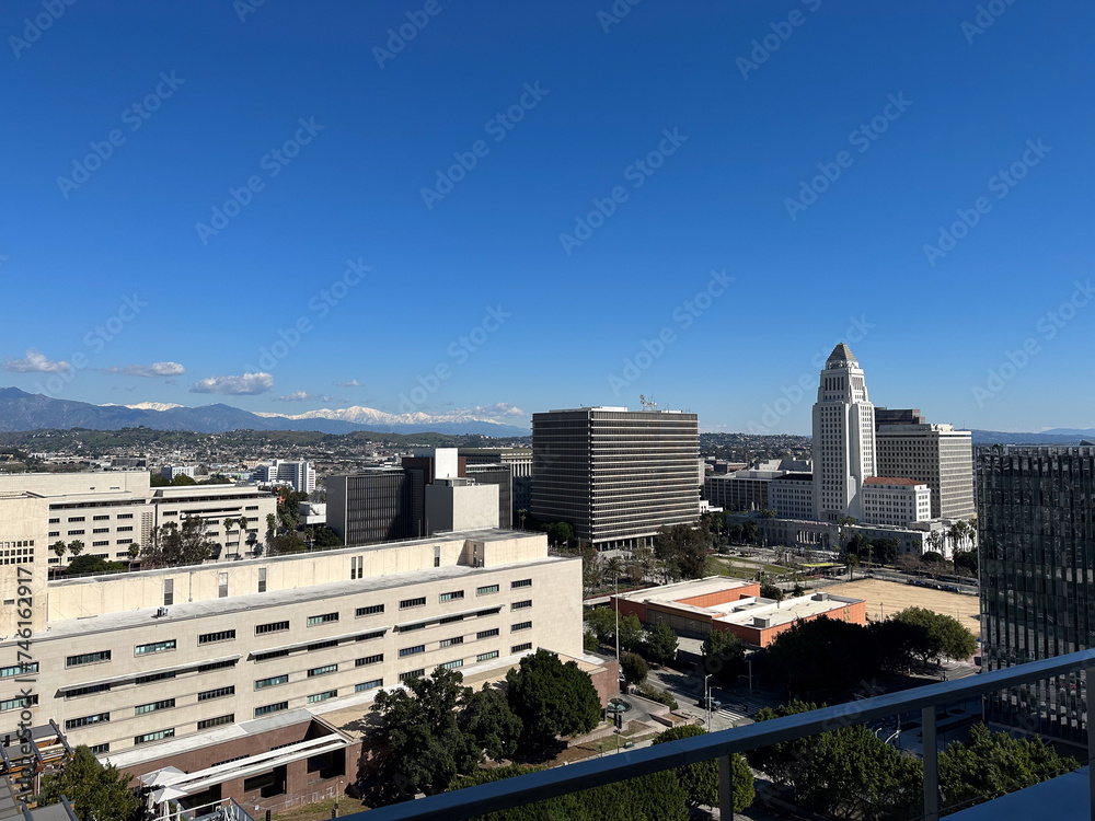 Los Angeles skyline, City Hall, snowy mountains in the background