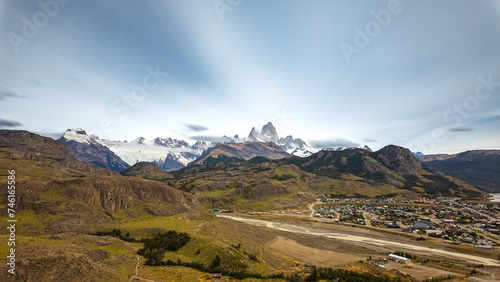 Majestic Mountain Peaks Overlooking a Serene Townscape
