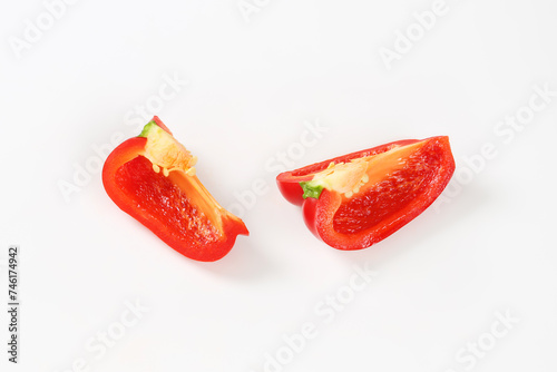 Two red bell pepper quarters