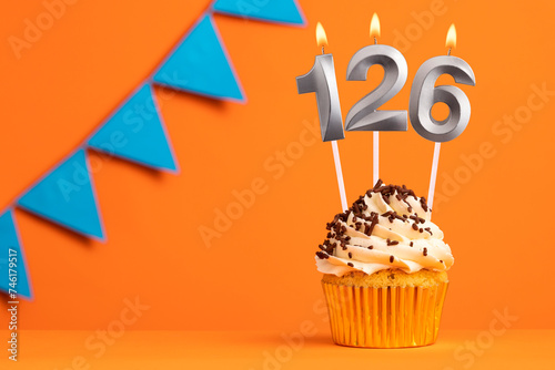 Candle number 126 - Cupcake birthday in orange background