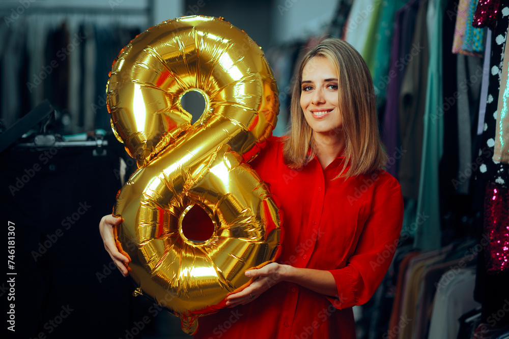 Happy Woman Celebrating 8th of March in a Fashion Store. Lady enjoying international women’s day shopping for presents 
