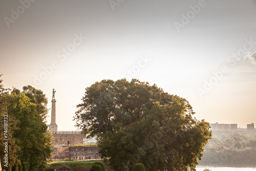 Victor statue on Kalemegdan fortress, during a sunny afternoon. Designed by Mestrovic in 1928, Pobednik is Located in Kalemegdan fortress, it's a landmark of the city of Belgrade, Serbia. photo