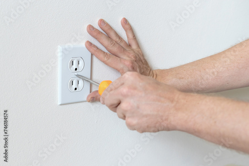 Electrical outlet installation. Outlet cover plate installation. 
