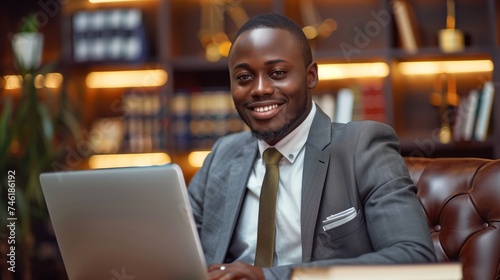 Smiling young man lawyer notary works in the office