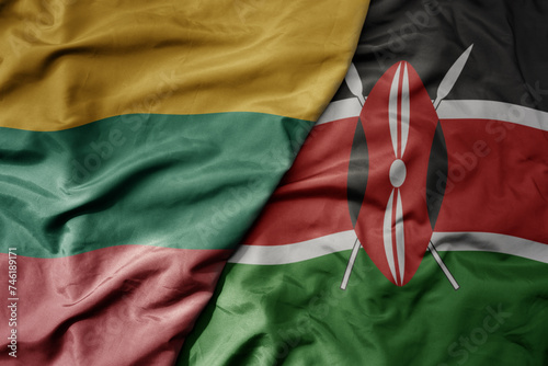 big waving national colorful flag of kenya and national flag of lithuania .