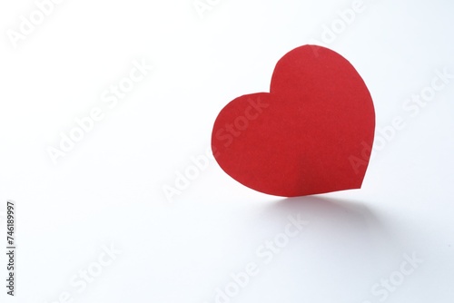 One paper heart on white background. Space for text