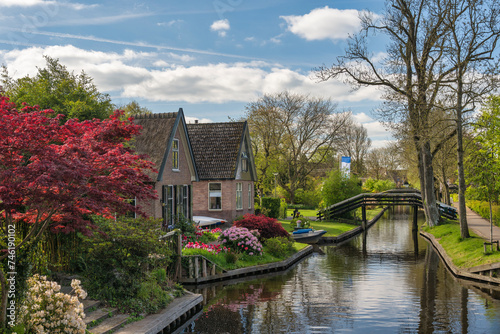 Giethoorn Netherlands, city skyline at canal and traditional house in Giethoorn village