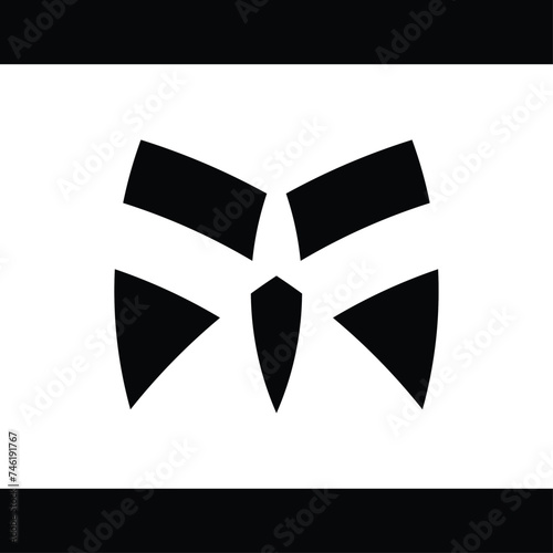 Abstract monogram designs shaped like masks or faces are appropriate