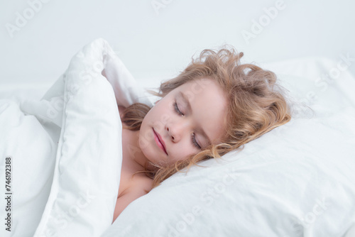 Daily sleep. Kid sleeping in bed. Child sleeping in bed under blanket. Kid lying on pillow, child rest asleep, enjoy healthy sleep or nap.