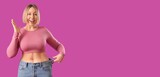 Happy woman in loose jeans on magenta background with space for text. Weight loss concept