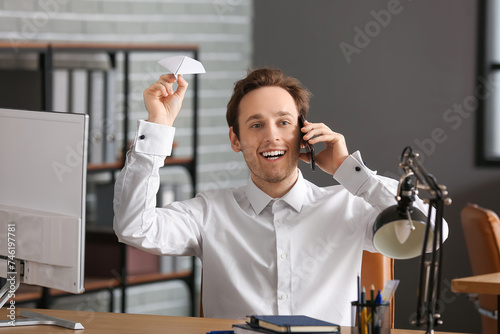 Young businessman with pape...