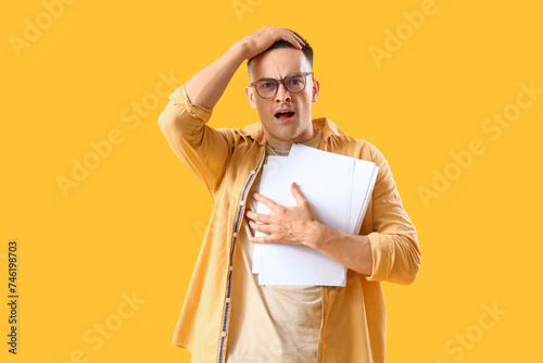 Stressed young man with pap...