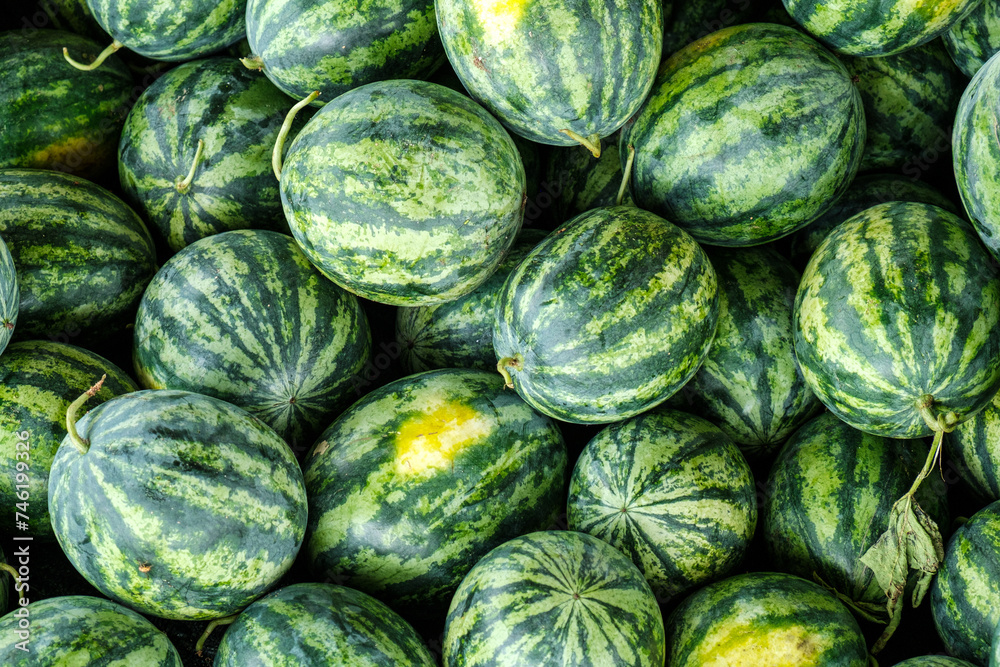 Many big sweet green watermelons at a market in Thailand Many big sweet green watermelons at a market in Thailand