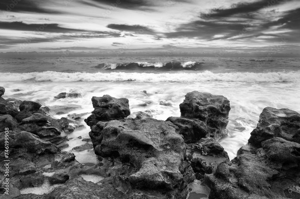 This BnW photograph showcases the raw power of the ocean against a rugged coastline, perfect for those seeking to convey the dramatic beauty of nature or to add a timeless oceanic theme to their space