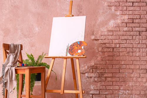Wooden easel with blank can...