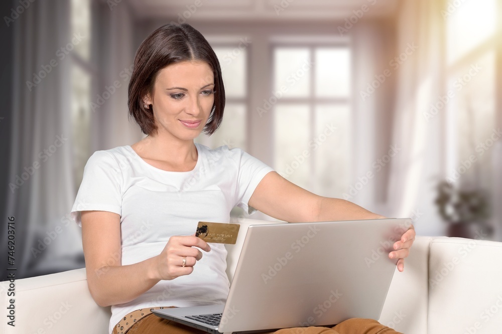 Attractive millennia female with credit card Attractive millennia female with credit card