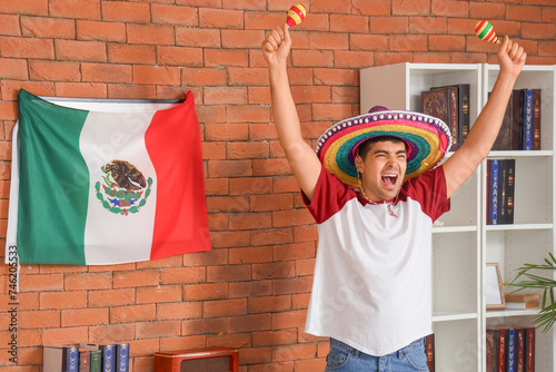 Young man in sombrero hat w...