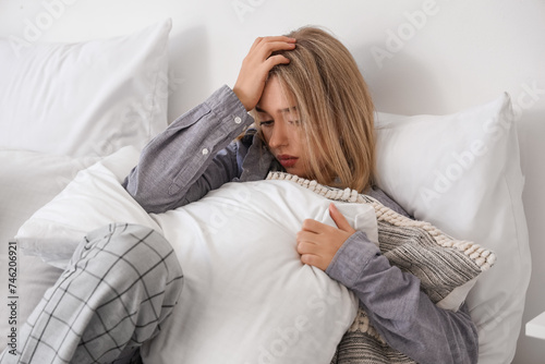 Depressed young woman with ...
