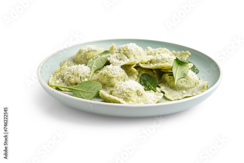 Plate of tasty ravioli with spinach and cheese on white background