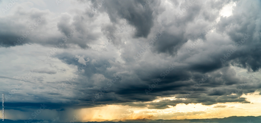 Fototapeta premium Storm clouds with the rain. Nature Environment Dark huge cloud sky black stormy cloud