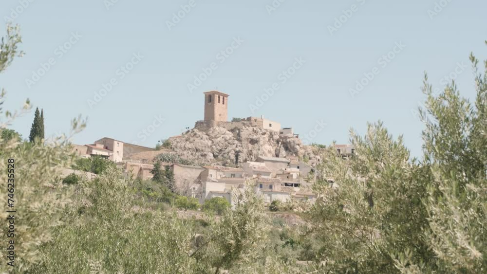 ANDALUSIAN VILLAGE WITH A CHURCH SURROUNDED BY OLIVE TREES ANDALUSIAN VILLAGE WITH A CHURCH SURROUNDED BY OLIVE TREES