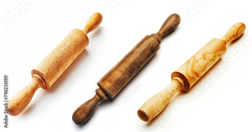 Three different types of wooden rolling pins with varying colors and patterns, isolated on a white background.