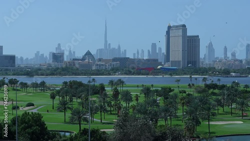 An amazing view of the Dubai skyline from the Dubai Golf Club in the United Arab Emirates photo