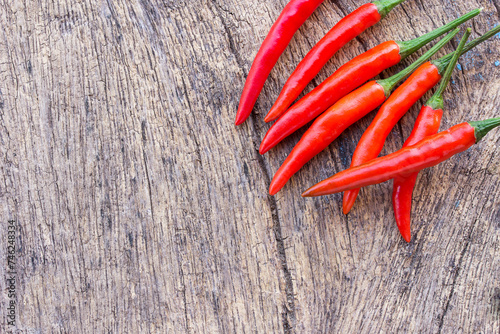 Red chili on an old wooden background.