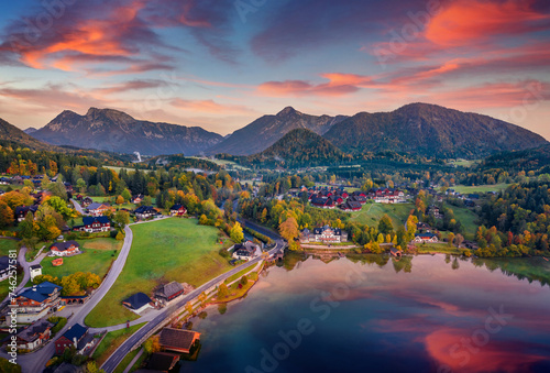 Spectacular autumn view from flying drone of Archkogl village. Marvelous sunrise on Grundlsee lake in Eastern Alps, Liezen District of Styria, Austria, Europe. Traveling concept background.. photo