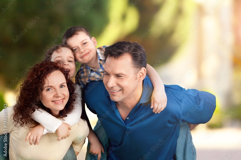 Happy young family posing with child