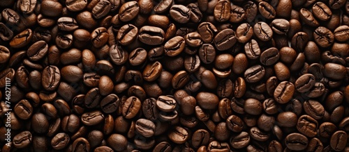 This photo captures a top view of coffee beans neatly stacked on top of each other, showcasing the essence and richness of coffee.