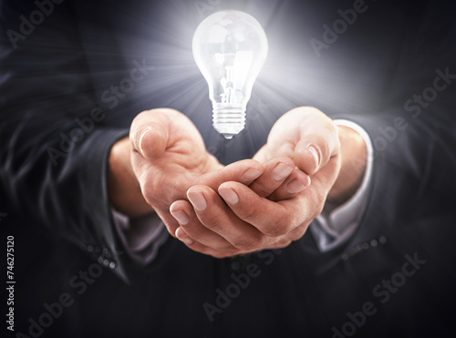 Hands, light bulb glow and idea for business growth, development and professional problem solving. Person with insights, corporate innovation and knowledge with enlightenment and inspiration