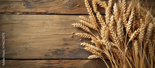 A photograph of a bountiful collection of wheat ears seamlessly blended into a rustic wooden surface.