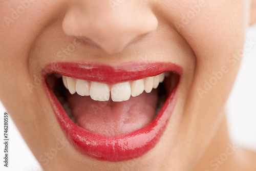 Happy woman, teeth and red lipstick with makeup for beauty, cosmetics or dental care on a white studio background. Closeup of person or model in satisfaction for lip gloss, glow or tooth whitening