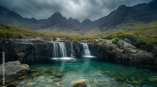 The surreal landscape of Fairy Pools in the Isle of Skye  Scotland  where crystal-clear pools of water are surrounded by dramatic mountains and moody skies. 